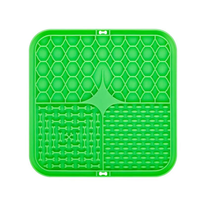 Green silicone dog lick mat with honeycomb and maze pattern, top view, white background